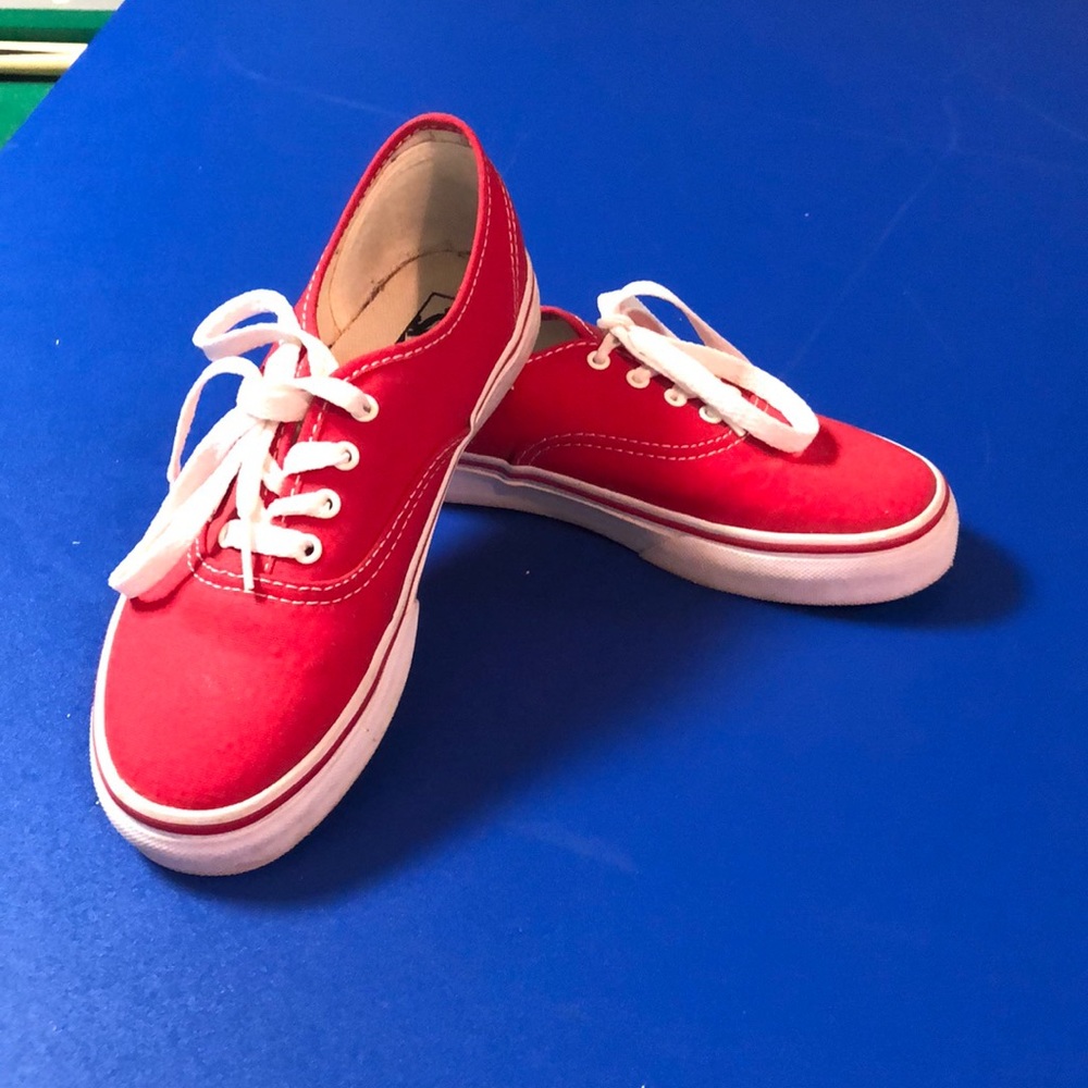 Red vans with white laces